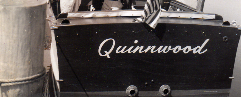 Quinnwood logo. An old wooden boat with the name quinnwood on the back.